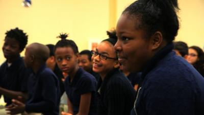 Students in the Embassy Adoption Program enjoy a musical performance