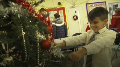 Boy and Christmas tree