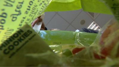 Man packing a shopping bag