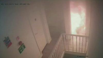 The explosion seen through kitchen door