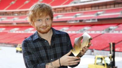 Ed Sheeran with his Official Number 1 Albums Award