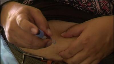 Man with diabetes injecting insulin