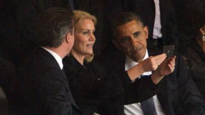 Danish Prime Minister Helle Thorning Schmidt takes a selfie with Barack Obama and David Cameron