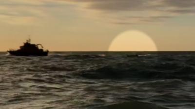 Migrant dinghy being towed to land