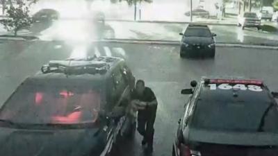 A thunderstorm in Florida knocked out power and caused a police officer to retreat to his vehicle for safety.