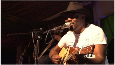 Sir Elvis playing the guitar in Nairobi