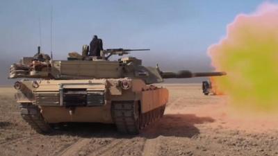 Iraqi forces tank firing shell