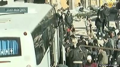 Lebanon's Al Manar TV shows people boarding the buses