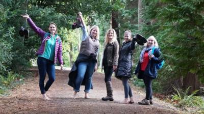 Walkers with their foots off in a forest.