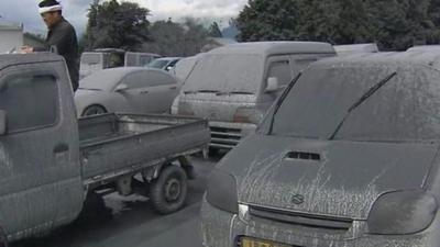 Cars covered in ash