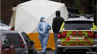 A police forensics officer at the scene