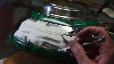 Trophy being engraved