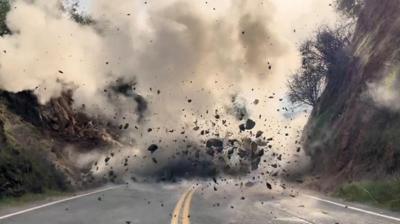 Boulders exploding in a road