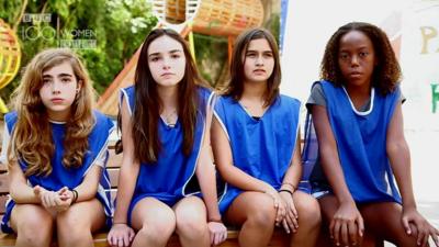 School girls in football kit