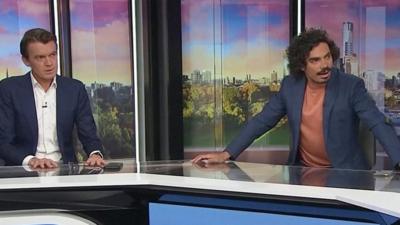 Breakfast tv presenters sitting at desk