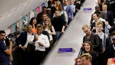Sadiq Khan on an escalator in Brixton Underground Station