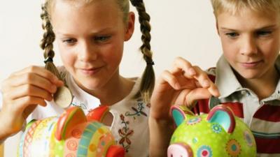 Children with piggy bank.