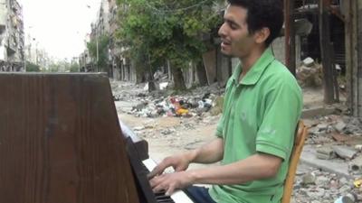 Ayham playing piano