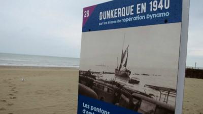 A sign commemorating Dunkirk on the beach