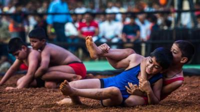 Wrestlers huddle with each other in the Kushti Akhada during Maharashtra cha Yashwant event at Rani Baug, Byculla, on February 23, 2019 in Mumbai, India.