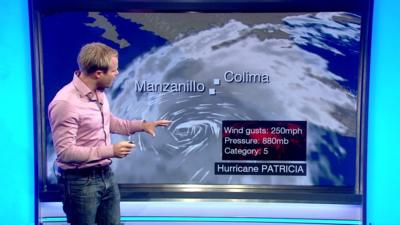 Simon King at weather map