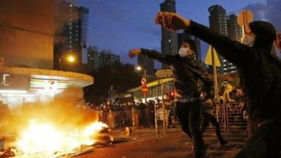 Rioters throw bricks at police