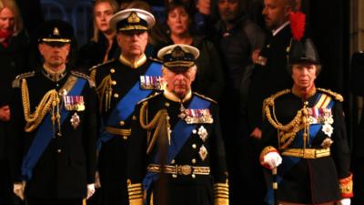 The Queen's four children hold a silent vigil