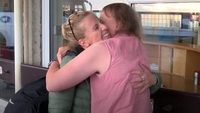 Nurse Lucy hugs her mother