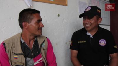 Farc rebel Hector Perez with a soldier of the Colombian Army