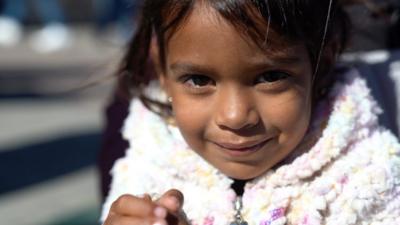 Portrait of a young Venezuelan girl in a white sweater