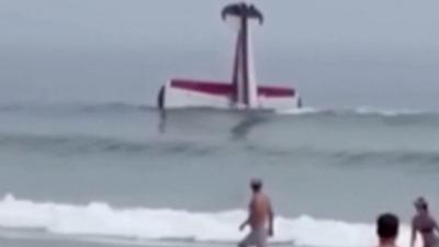 Small plane floats nose-down in the water