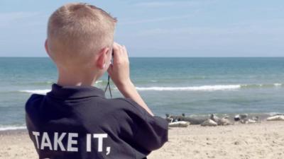 Boy looking out to sea.