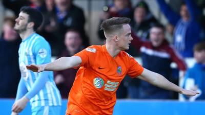 Linfield's Aaron Burns celebrates scoring against Warrenpoint Town