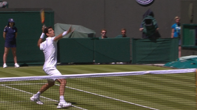 Thomaz Bellucci prepares for his wayward smash against Rafael Nadal