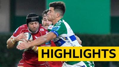 Leigh Halfpenny of Scarlets is tackled by Benetton's Ignacio Mend.