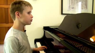 Ethan Loch playing the piano