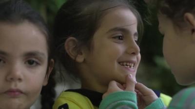 Three children who have made the journey from Turkey to Lesbos