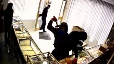 CCTV footage showing the raiders using hammers to smash the display cases at Sunny Jewellers