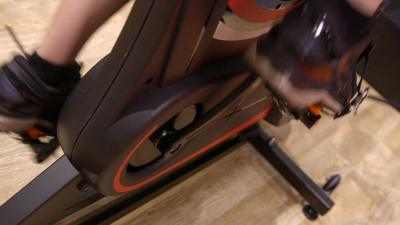 A person on an exercise bike