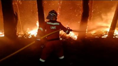 The approach of Hurricane Ophelia has brought strong winds that have fanned the flames.