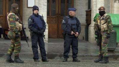 Armed soldiers guard the Grand Place