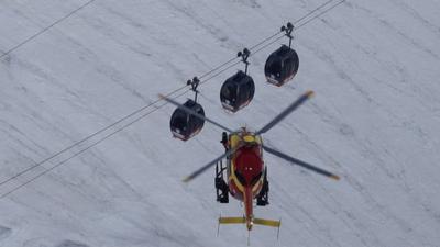 Helicopter and cable cars