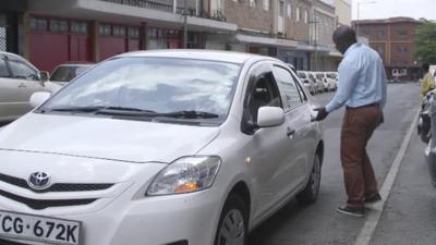 Man getting into taxi