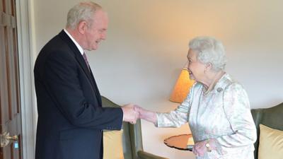 Martin McGuinness shakes hands with the Queen