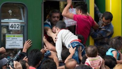 Migrants board trains in Keleti station, Budapest