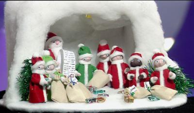 A Blue Peter made Santa's grotto with Santa and his elves.