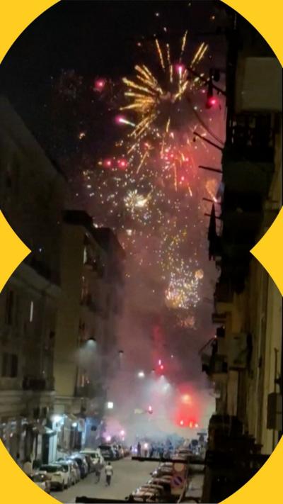 Fireworks exploding above a road in Napoli 