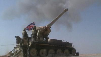 Tank firing gun during first Gulf War