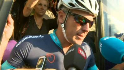 Lance Armstrong arriving at start of race