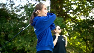 A student at Maplewell Hall School playing golf